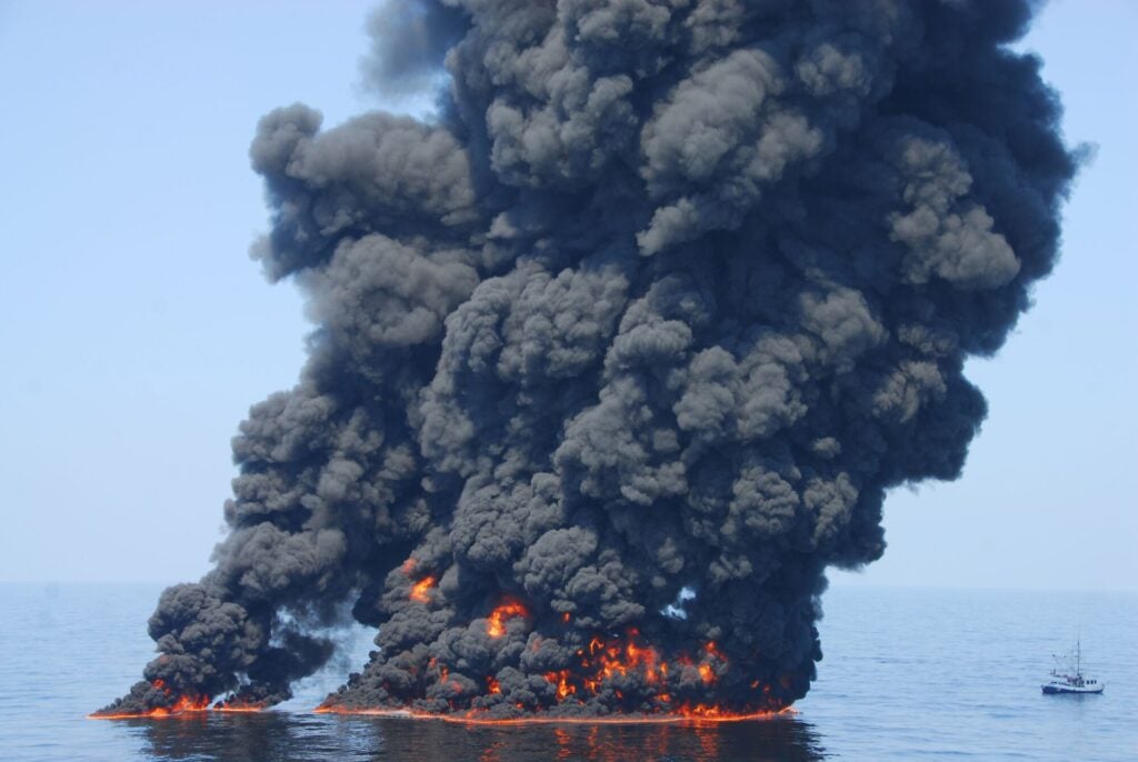 A controlled burn of oil from the Deepwater Horizon/BP oil spill sends towers of fire hundreds of feet into the air over the Gulf of Mexico on June 9, 2010. (Petty Officer First Class John Masson / US Coast Guard)