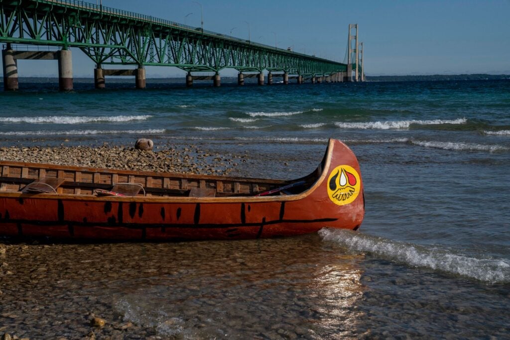 One of the Little Traverse Bay Bands of Odawa canoes at the "Pipe Out Paddle Up: Floatilla Against the Line 5 Pipeline" in Mackinaw City, Mich., on Sept. 3, 2022.
